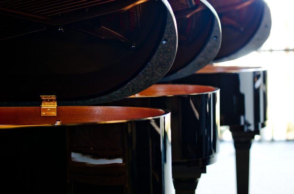 Close up photo of grand pianos | Ogden Piano Gallery