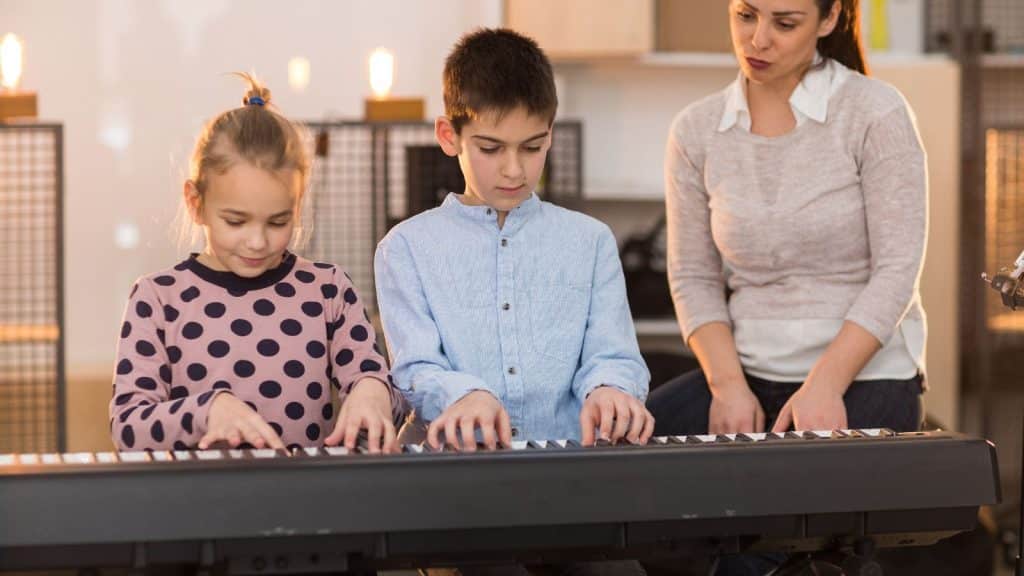 A Strict Mother Teaching Her Two Kids How to Play the Piano